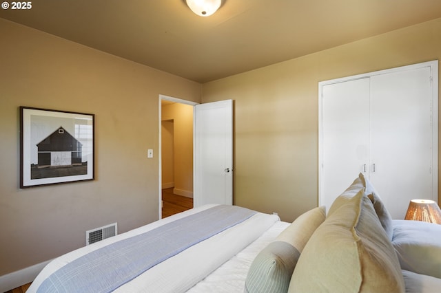 4770 SW Beech Dr, Beaverton, OR 97005 - bedroom with a closet, baseboards, and wood finished floors