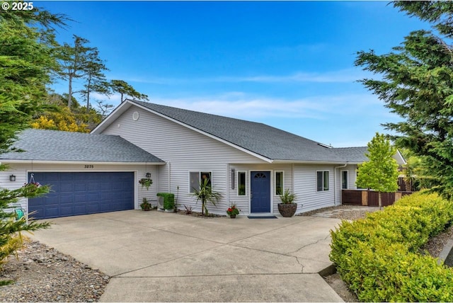 3275 Redwood Loop, Florence, OR 97439 - view of front of house featuring an attached garage, driveway, and roof with shingles