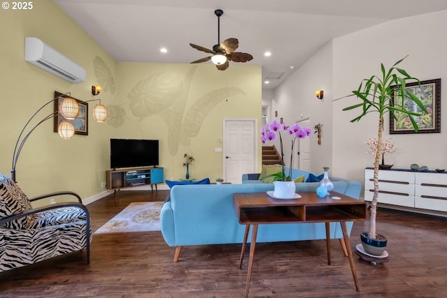 3275 Redwood Loop, Florence, OR 97439 - living area with a wall mounted AC, wood finished floors, ceiling fan, stairs, and recessed lighting