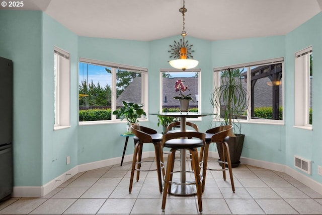 3275 Redwood Loop, Florence, OR 97439 - dining area with baseboards and light tile patterned flooring