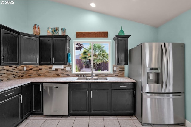 3275 Redwood Loop, Florence, OR 97439 - kitchen with appliances with stainless steel finishes, lofted ceiling, a sink, tasteful backsplash, and light tile patterned flooring