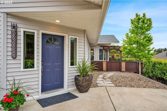 3275 Redwood Loop, Florence, OR 97439 - doorway to property featuring a pergola, a shingled roof, and a patio