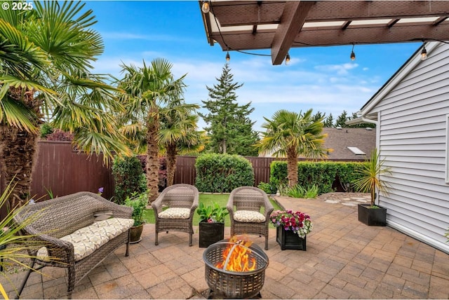 3275 Redwood Loop, Florence, OR 97439 - fenced backyard featuring a pergola, a patio, and an outdoor fire pit