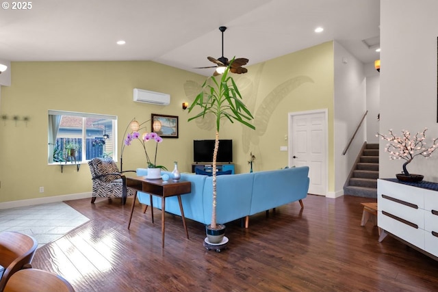 3275 Redwood Loop, Florence, OR 97439 - living room with a wall mounted AC, a ceiling fan, wood finished floors, baseboards, and vaulted ceiling