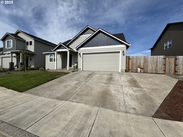 987 Farmington Dr, Junction City, OR 97448 - view of front of house with a garage, driveway, and board and batten siding