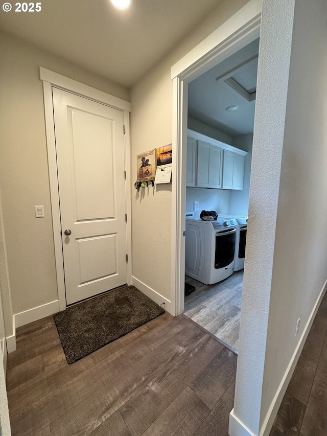 987 Farmington Dr, Junction City, OR 97448 - foyer entrance with independent washer and dryer, wood finished floors, and baseboards