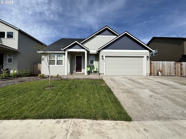 987 Farmington Dr, Junction City, OR 97448 - view of front of house featuring a garage, driveway, and board and batten siding