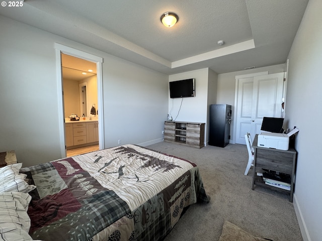 987 Farmington Dr, Junction City, OR 97448 - bedroom with light colored carpet, baseboards, a raised ceiling, and ensuite bathroom