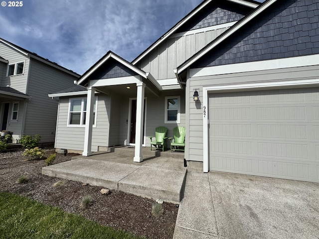 987 Farmington Dr, Junction City, OR 97448 - view of front of home featuring board and batten siding and a garage