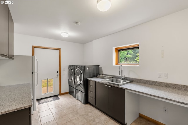 88369 Timberline Dr, Veneta, OR 97487 - laundry room with washer and clothes dryer, light tile patterned floors, and a sink
