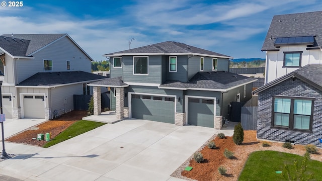4308 N 12th Way, Ridgefield, WA 98642 - view of front facade featuring an attached garage, concrete driveway, and stone siding