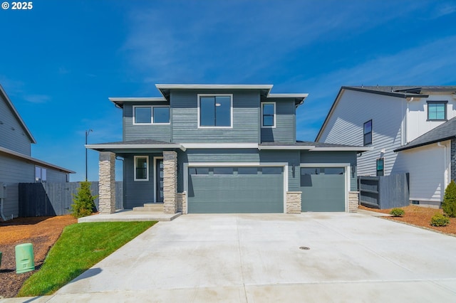 4308 N 12th Way, Ridgefield, WA 98642 - view of front of property featuring concrete driveway, an attached garage, and stone siding