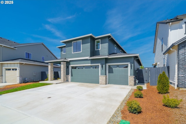 4308 N 12th Way, Ridgefield, WA 98642 - view of front of home with stone siding, an attached garage, and driveway