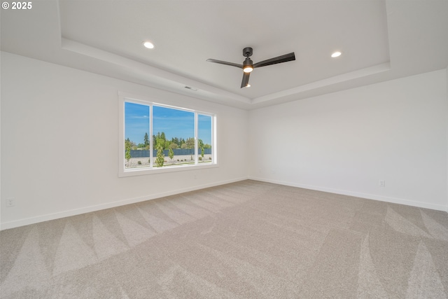 4308 N 12th Way, Ridgefield, WA 98642 - spare room with a tray ceiling, recessed lighting, ceiling fan, and carpet