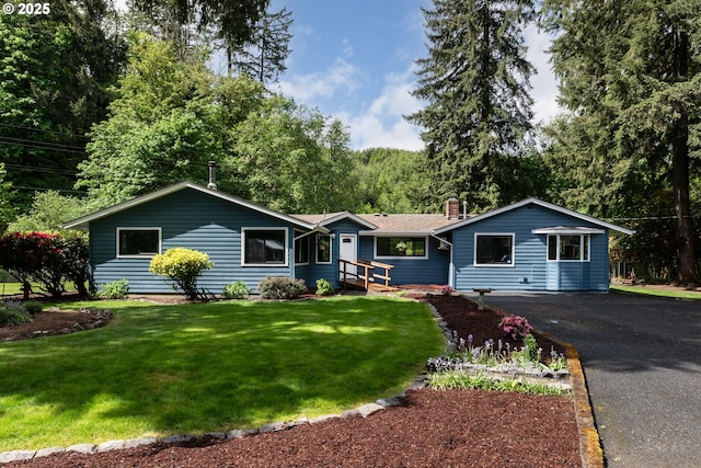 27539 Kingsley Rd, Scappoose, OR 97056 - ranch-style house featuring a chimney, a front lawn, and driveway