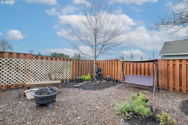 view of yard featuring a fire pit