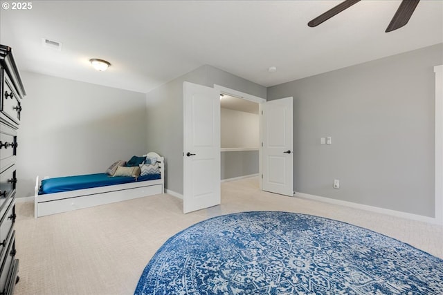 bedroom featuring light carpet and ceiling fan