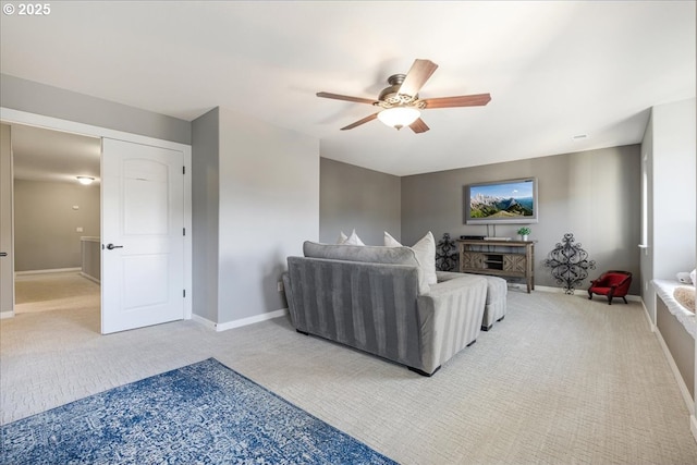 living room featuring ceiling fan and light colored carpet