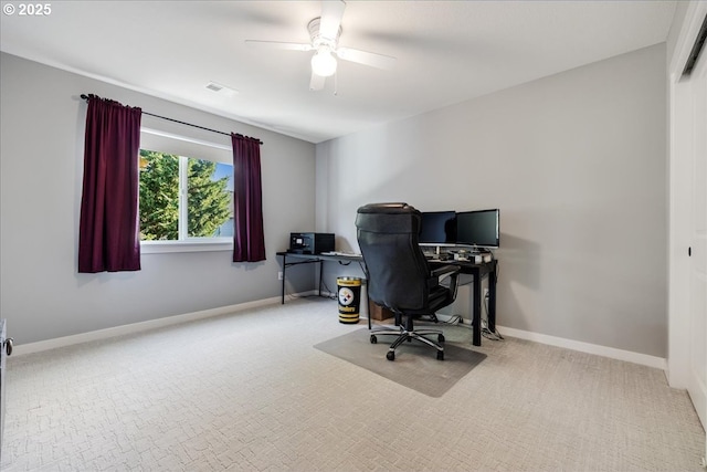 home office with ceiling fan and carpet flooring