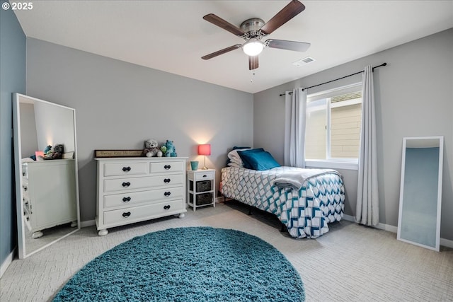 bedroom featuring light carpet and ceiling fan