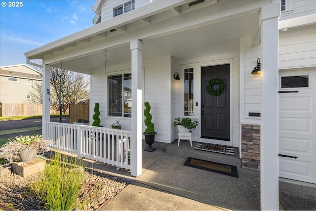 property entrance with covered porch