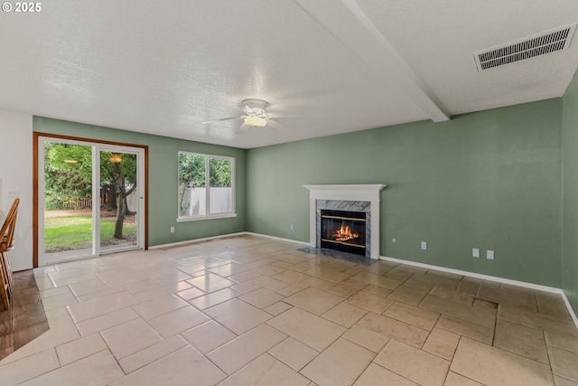 4720 NE 124th Ct, Vancouver, WA 98682 - unfurnished living room featuring ceiling fan, a high end fireplace, and a textured ceiling