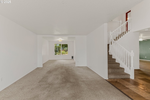 4720 NE 124th Ct, Vancouver, WA 98682 - unfurnished living room featuring stairway, carpet flooring, and a ceiling fan