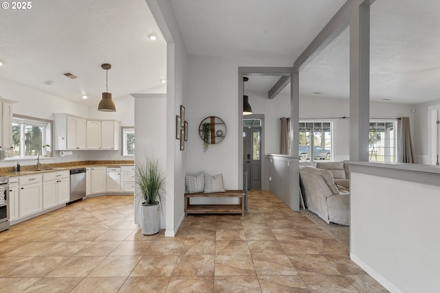 kitchen featuring recessed lighting, visible vents, white cabinetry, open floor plan, and appliances with stainless steel finishes