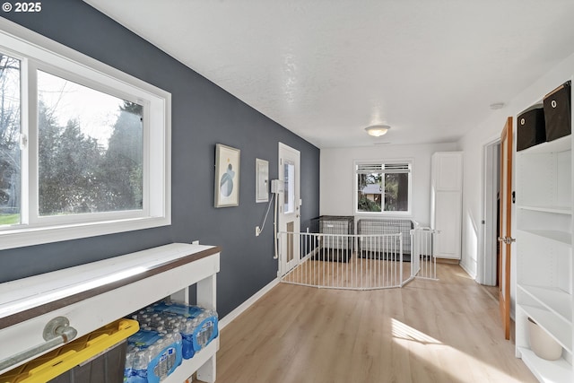 entrance foyer featuring baseboards and light wood-style floors