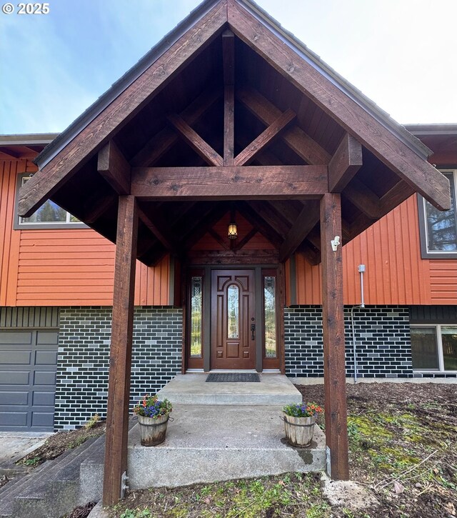 15400 SE Barlow Ct, Damascus, OR 97089 - doorway to property with brick siding and board and batten siding