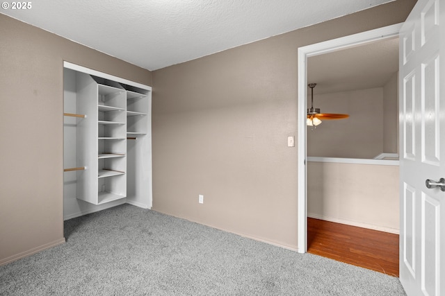 unfurnished bedroom featuring baseboards, a closet, and carpet floors