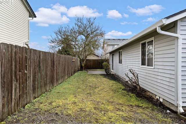 view of yard with a fenced backyard