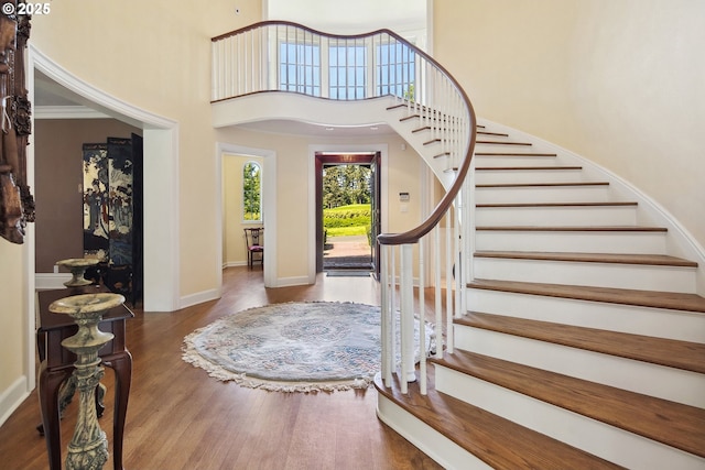 1500 SE Waverly Dr, Milwaukie, OR 97222 - entrance foyer featuring stairway, wood finished floors, a high ceiling, and baseboards