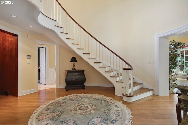 1500 SE Waverly Dr, Milwaukie, OR 97222 - foyer entrance with stairs, wood finished floors, a high ceiling, recessed lighting, and baseboards