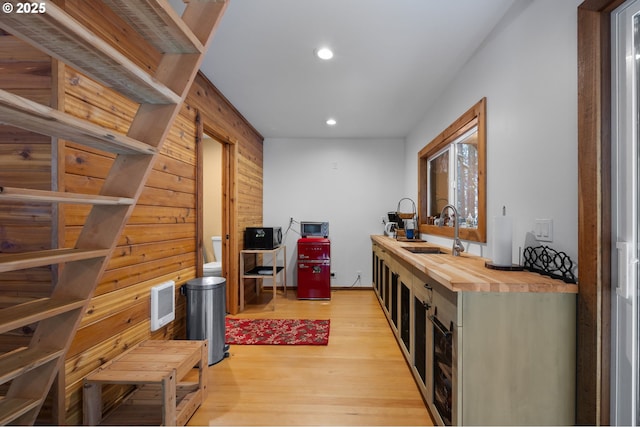 78596 E Rd 32, Government Camp, OR 97028 - hallway with recessed lighting, a sink, wooden walls, light wood-style floors, and visible vents