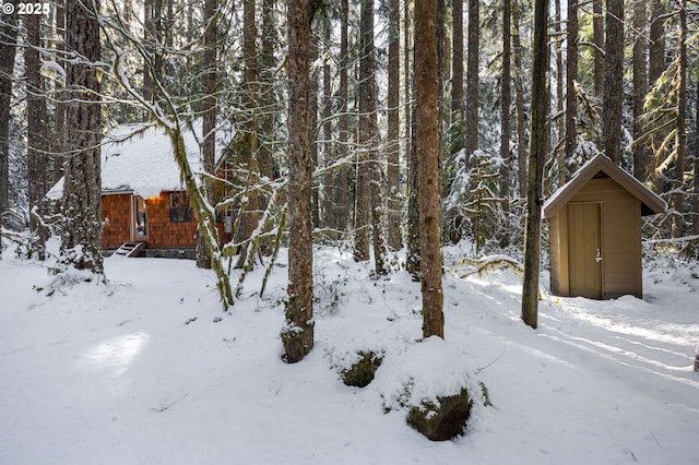 78596 E Rd 32, Government Camp, OR 97028 - yard layered in snow featuring an outbuilding and a storage unit