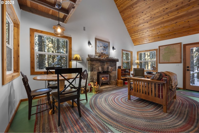 dining space featuring high vaulted ceiling and wood ceiling