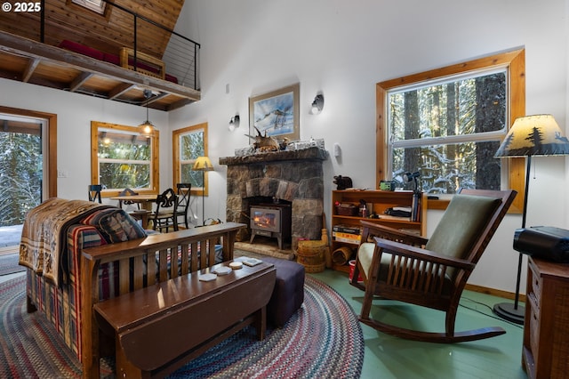 living room with a healthy amount of sunlight and a high ceiling