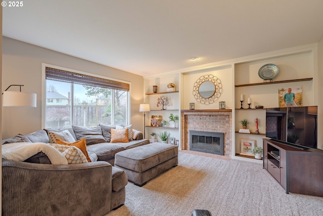 carpeted living room with a brick fireplace and built in shelves