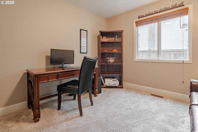 home office with light colored carpet and lofted ceiling