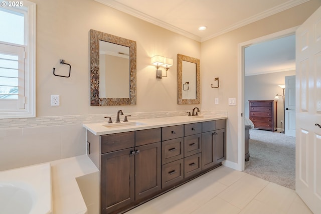 bathroom with crown molding and vanity