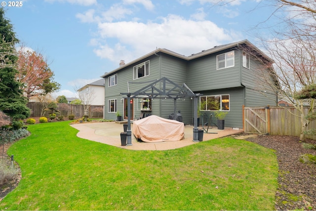 back of house featuring a yard and a patio