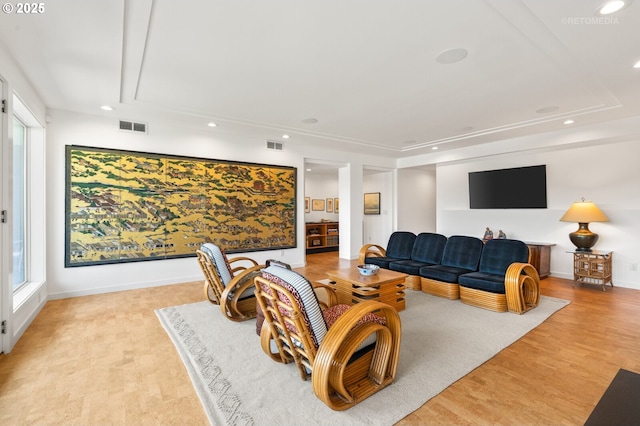 living room featuring recessed lighting, attic access, light wood-style floors, and baseboards