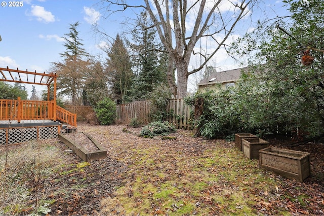 view of yard with a wooden deck