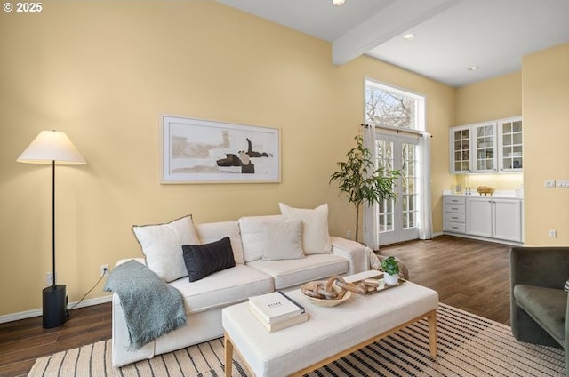 living room featuring beam ceiling, wood finished floors, recessed lighting, french doors, and baseboards