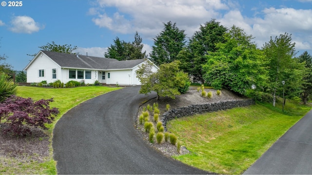 657 Summit Ave, Gearhart, OR 97138 - view of front of home featuring a garage, asphalt driveway, and a front yard