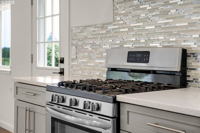 657 Summit Ave, Gearhart, OR 97138 - kitchen with gas range and tasteful backsplash