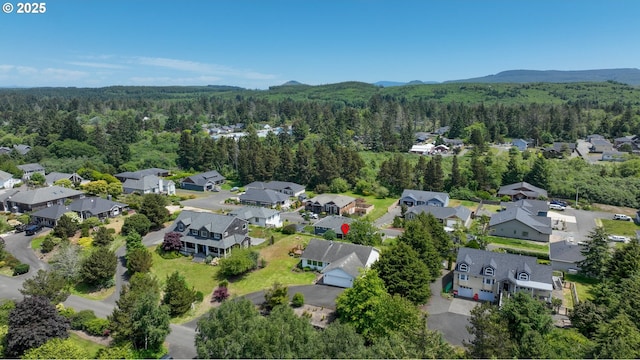 657 Summit Ave, Gearhart, OR 97138 - aerial view of residential area featuring a forest and a mountainous background