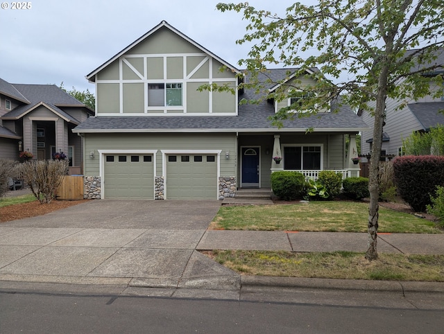 17458 SW Inkster Dr, Sherwood, OR 97140 - view of front of home with roof with shingles, a garage, covered porch, driveway, and stone siding