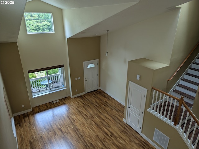 17458 SW Inkster Dr, Sherwood, OR 97140 - entrance foyer featuring high vaulted ceiling, wood finished floors, and stairway